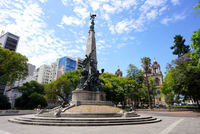 Low angle view of statue against sky