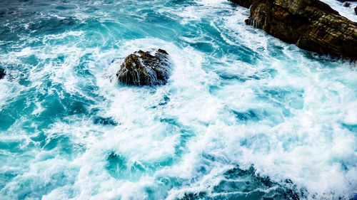 Waves splashing on rocks