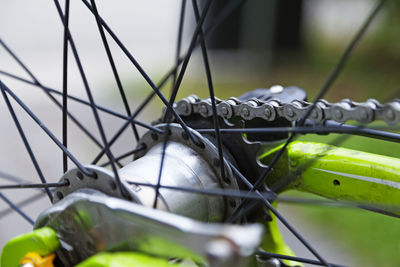 Close-up of bicycle on metal fence