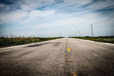 View of empty road passing through landscape