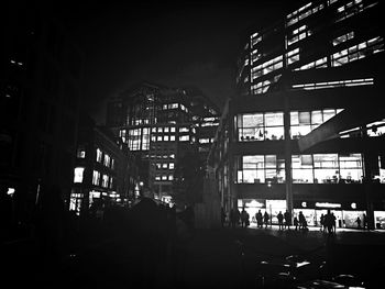 Illuminated buildings in city at night