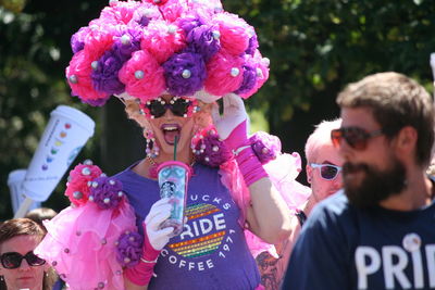 Close up of woman holding pink flower