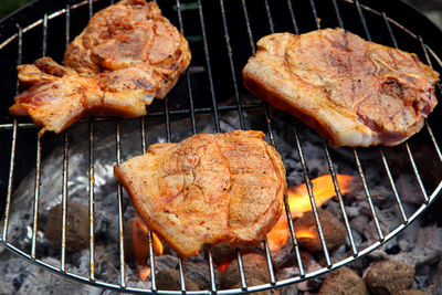 Close-up of meat cooking on barbecue grill