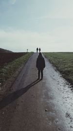 People walking on country road