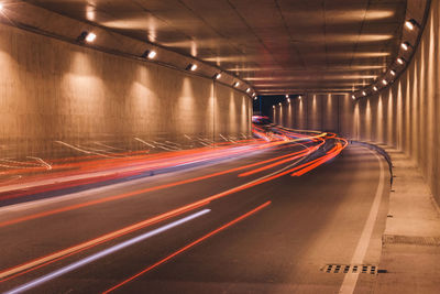 Light trails in tunnel at night