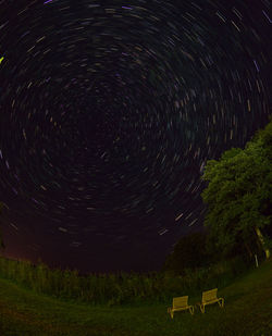 Scenic view of field against sky at night