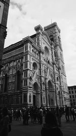 Tourists in front of building