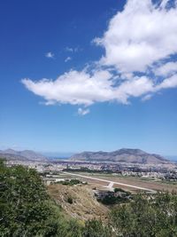 Scenic view of landscape against blue sky