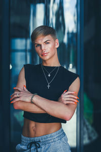 Portrait of young gay man standing outdoors