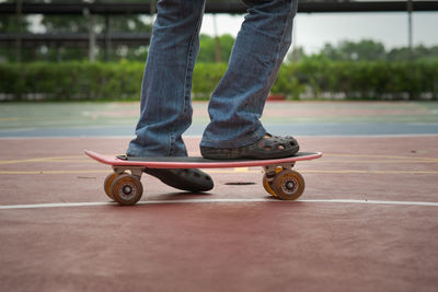 Low section of person skateboarding on skateboard