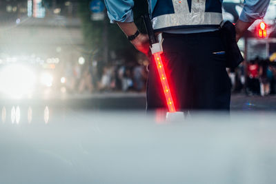 Close-up of man with red umbrella