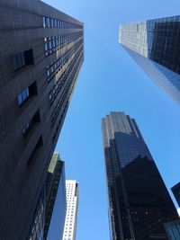 Low angle view of skyscrapers against clear sky