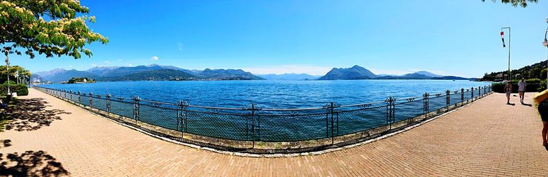 Panoramic view of sea against blue sky