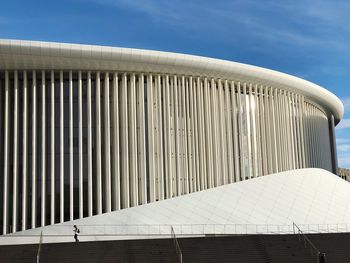 Full frame view of modern white architecture hall against blue sky