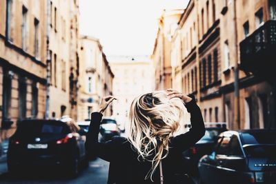 Woman standing on street in city