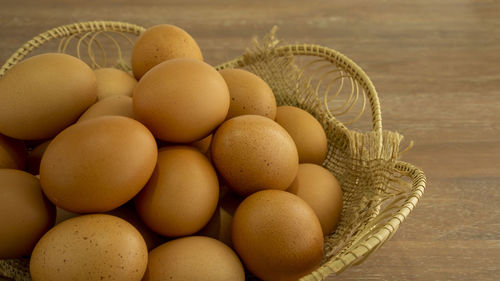 High angle view of eggs in basket on table