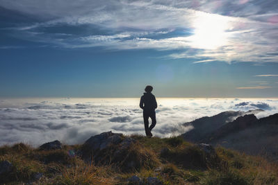 Full length of man standing on land against sky