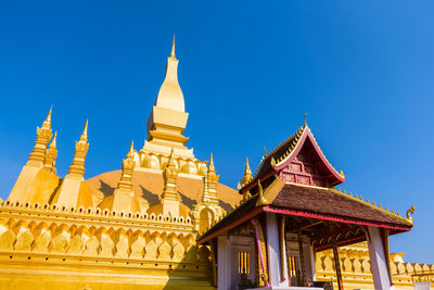 Low angle view of temple building against blue sky