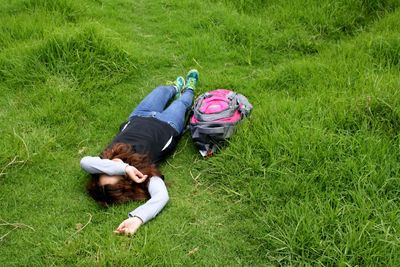 High angle view of couple lying on land