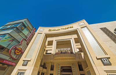 Low angle view of building against blue sky