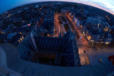 High angle view of illuminated buildings in city