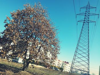 Low angle view of communications tower against sky