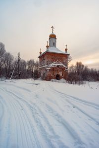 Built structure on snow covered landscape