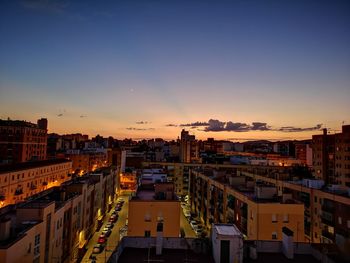 High angle view of buildings against sky during sunset