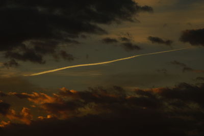 Low angle view of cloudy sky at sunset