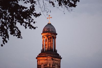 Low angle view of bell tower against sky