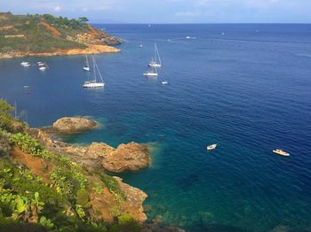 High angle view of boats sailing in sea against sky