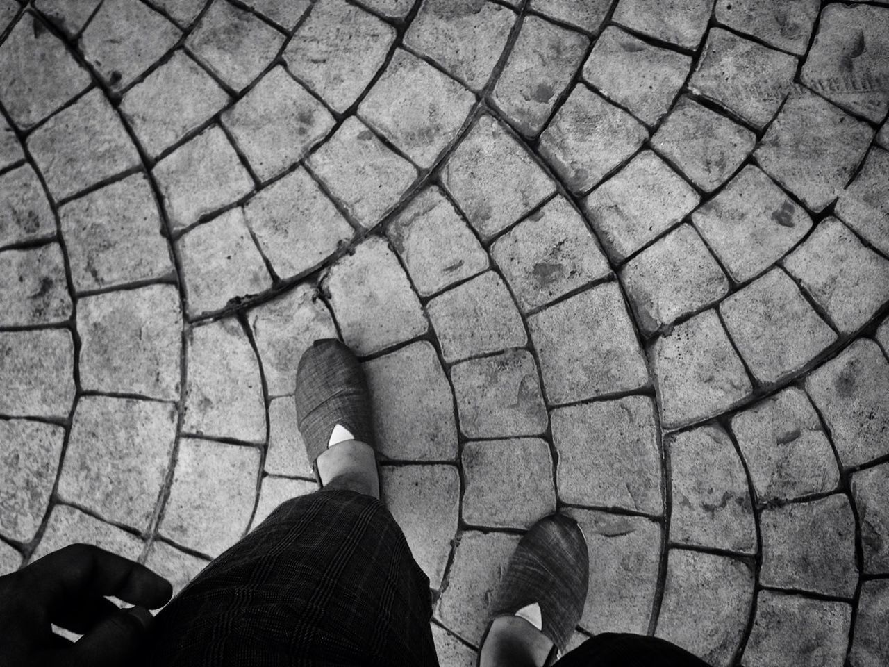 low section, person, personal perspective, lifestyles, leisure activity, standing, men, shoe, cobblestone, unrecognizable person, high angle view, human foot, street, part of, footpath, paving stone