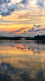 View of lake against cloudy sky during sunset