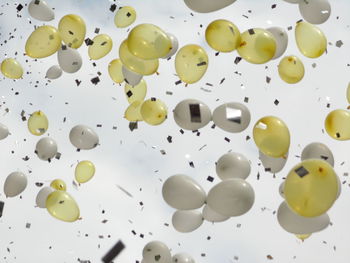 Low angle view of balloons in air