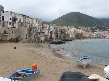 Panoramic view of beach and buildings against sky