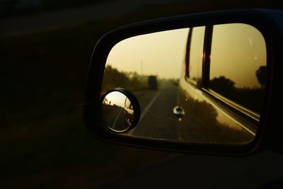 Reflection of car on side-view mirror