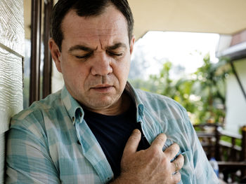 Mature man suffering from chest pain