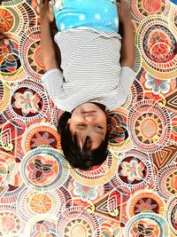 High angle view of woman lying down on floor