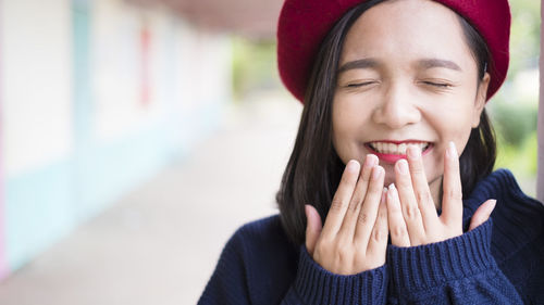 Close-up portrait of a smiling young woman