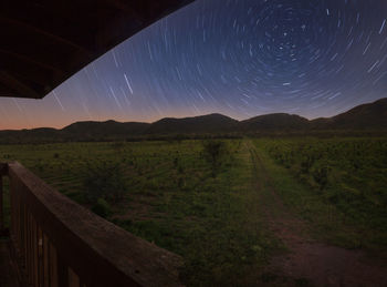Scenic view of field against sky at night