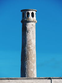 Low angle view of built structure against blue sky