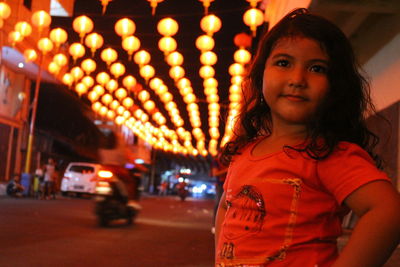 A kids stand at mooncake festival with lighting decoration in background
