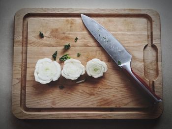 High angle view of chopped bread on cutting board