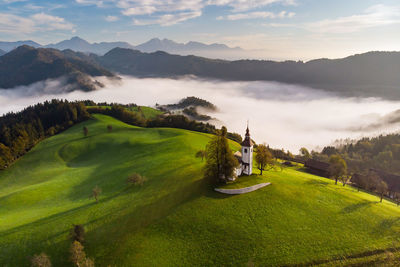 Scenic view of landscape and mountains against sky