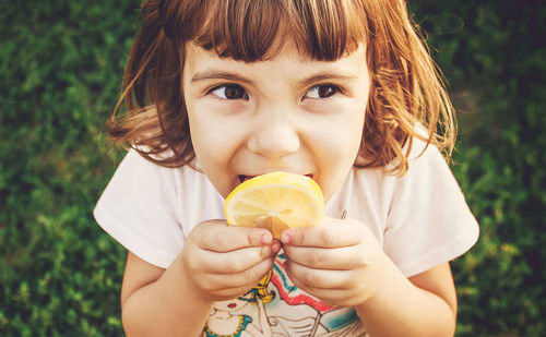 Portrait of woman holding ice cream cone