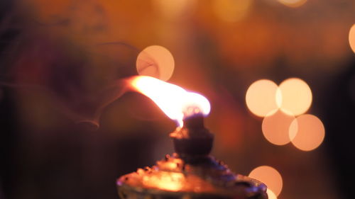 Close-up of burning candle