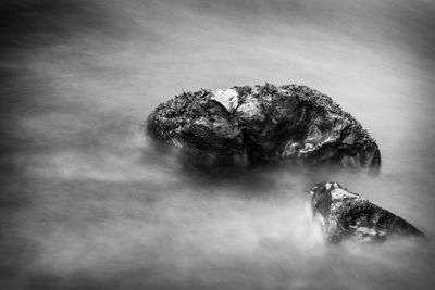 Scenic view of rock against sky