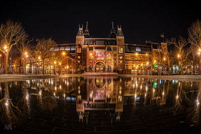 Reflection of illuminated buildings in water