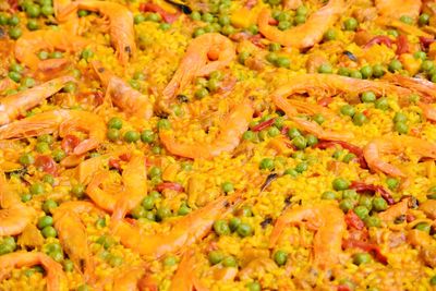 Full frame shot of orange fruit over white background