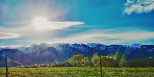 Scenic view of snowcapped mountains against sky